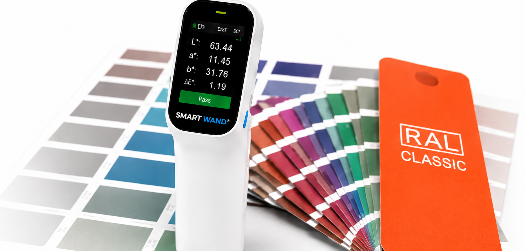 SmartWand portable spectrophotometer measuring colour against a paint colour chart